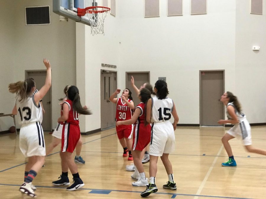 The JV basketball team defends Waldorf during the second quarter of the game. The quarter ended with Cubs up 8-6, but the game ended with a Convent loss of 23-15. 