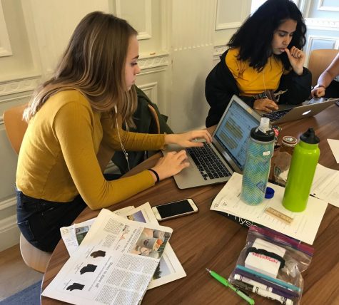 Freshman Sarah Barnes and sophomore Malinalli Cervantes study for final exams during their F block free period. Finals will continue through Tues. 19.