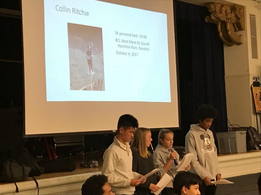 Cross-country captain Maggie Walter reads a tribute to team member Colin Ritchie. Each runner was asked to write a short paragraph about one of their teammates, which the team captains read aloud at the banquet.