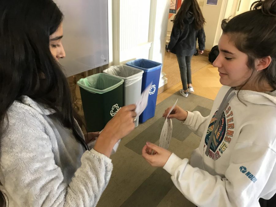 Simple Gifts board member Asha Khanna teaches new board member Bella Shea how to sell candy grams. The profits will go a fashion show which will raise money for the non-profit organization Every Mother Counts.