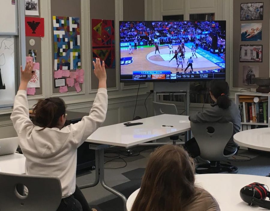 Juniors in history teacher Sarah Garlinghouse’s IB History class watch the beginning of the second half of the Loyola University Chicago, University of Miami game before beginning a test. Garlinghouse also airplayed the University of Pennsylvania, University of Kansas match during lunch.
