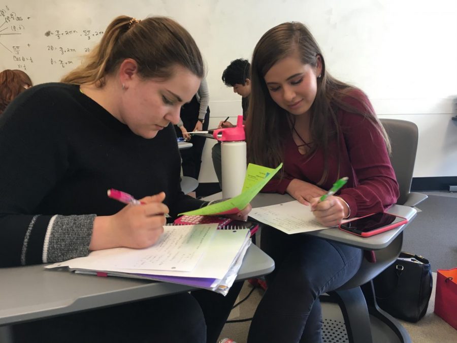 Seniors Francesca Petruzzelli and Annabelle Leung work on math during their first day back from Spring break. The last day of classes for seniors is May 18 with graduation following the next week on May 25. 