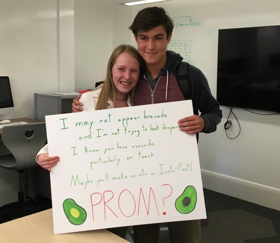 Juniors Worth Taylor and Nick McGee hold up the sign McGee made to prompose to Taylor. Mcgee also gave Taylor avocado toast.