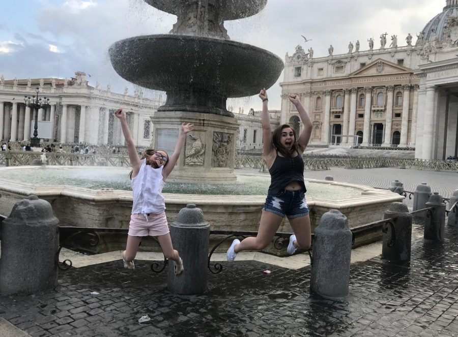 Senior+Megan+Mullins+jumps+with+her+sister+in+front+of+the+Fountains+of+St.+Peters+Square+in+Italy+in+June.+Students+shared+their+summer+experiences%2C+ranging+from+vacation+to+summer+school.+