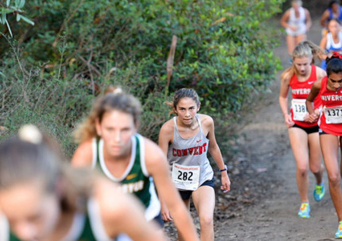 Sophomore Dagny Wallace runs up the hill at the Artichoke Invitational on Oct. 6. The cross-country team has competed in five invitationals and two league meets so far this season.
