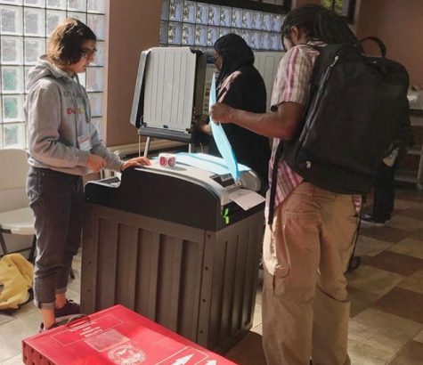 High school students volunteer at polls