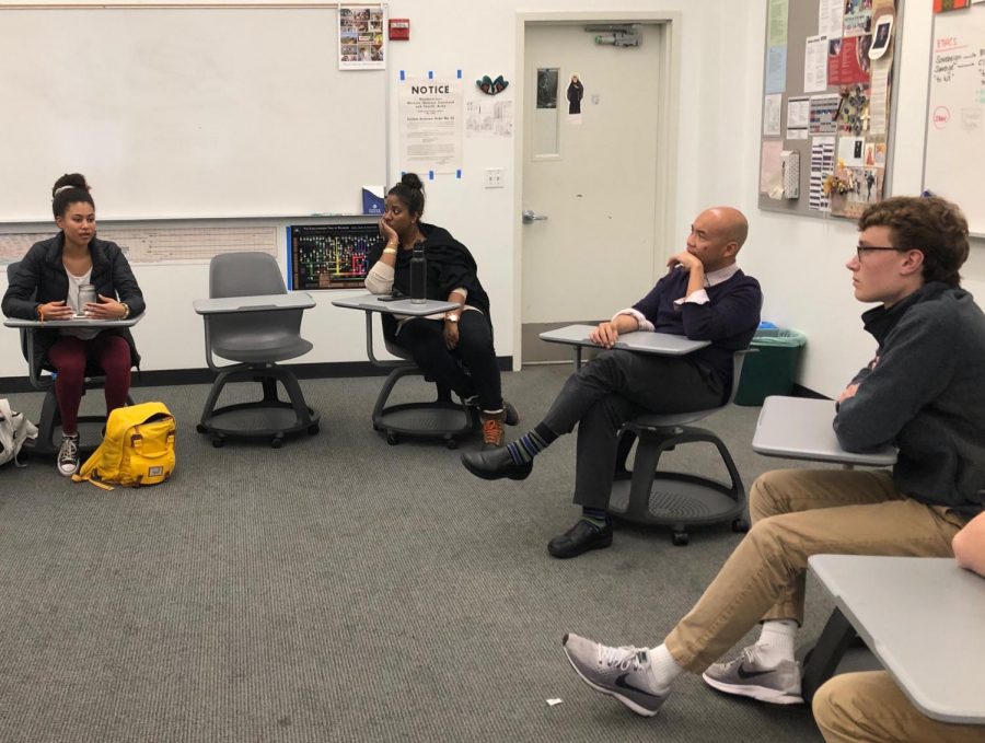 Junior Maxi Tellini, Ethics Teacher Michael Campos and People of Color Student Union advisor Allyson Maebert listen to junior Ryann Minnis during a Collab meeting. Students had previously expressed interest in making a safe coed space to discuss  race and ethnicity.