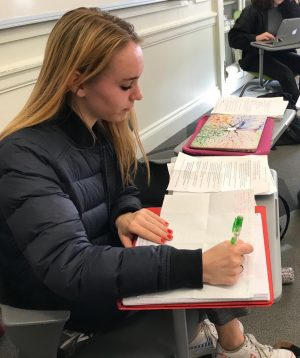 Sophomore Tabitha Parent brainstorms her study plan for finals week after watching a video on study tips. The video suggested students make a chart with each course and the topics needed for review.