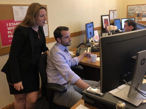 Miller Hall looks over fellow Legislative Aide Wyatt Donnelly-Lan Holts shoulder at an email from Supervisor Stefani in their office at City Hall. Miller Halls daily duties as a Legislative Aide include responding to emails and phone calls, working on projects within the district and managing all operations on Supervisor Stefanis schedule