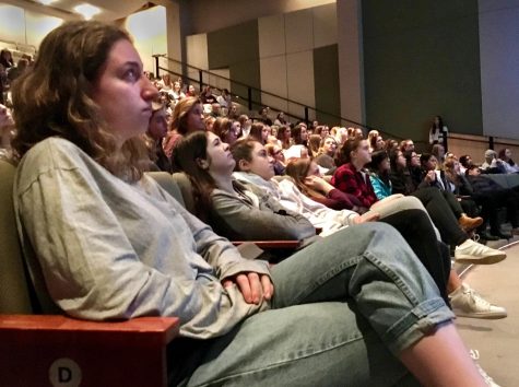 Senior Poppy Cohen watches the video 50/50, which discusses women who have held and currently hold high political positions, during assembly. The assembly highlighted the importance of empathy. 