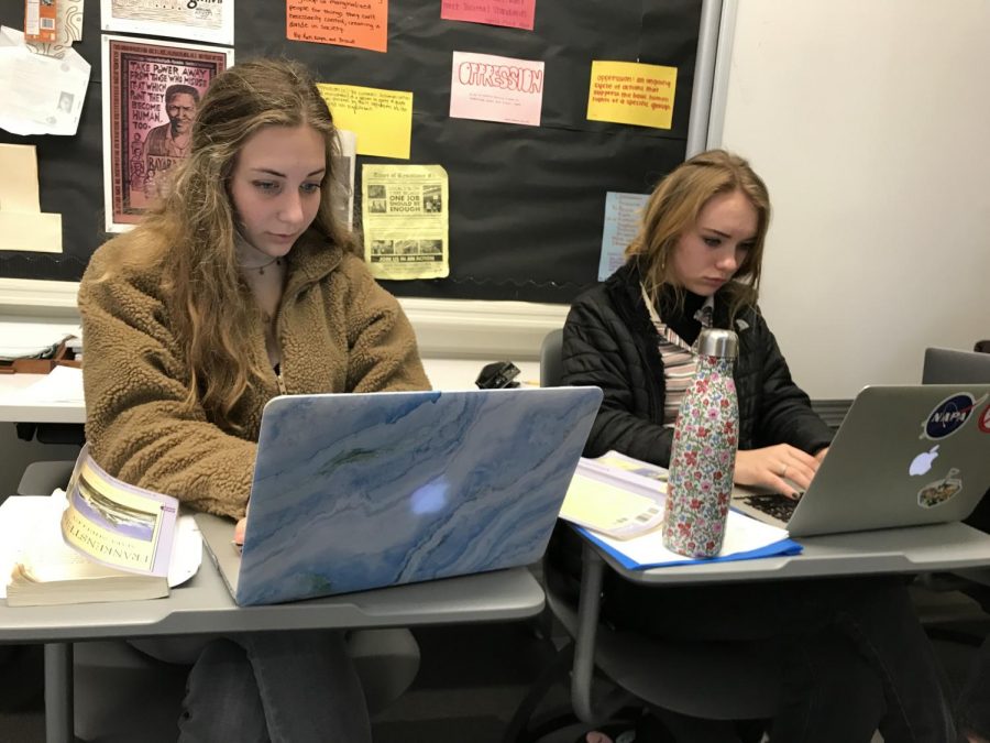 Sophomores Charlotte Ehrlich and Tabitha Parent brainstorm outlines for their Frankenstein essays during class today. The essay is due after Winter Break. 