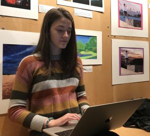 Sophomore Halsey Williamson proofreads her poem before submitting it to English teacher Angelica Allen for the annual poetry festival. All students are required to submit 1 to 2 poems before Friday, April 5th. 