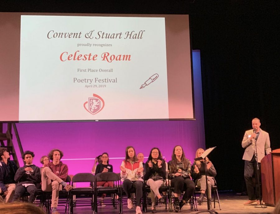 Guest Speaker David Nyquist announces the Convent High School Poetry competition winner, Celeste Roam. Winners were told to stand so they could be recognized by their peers. 