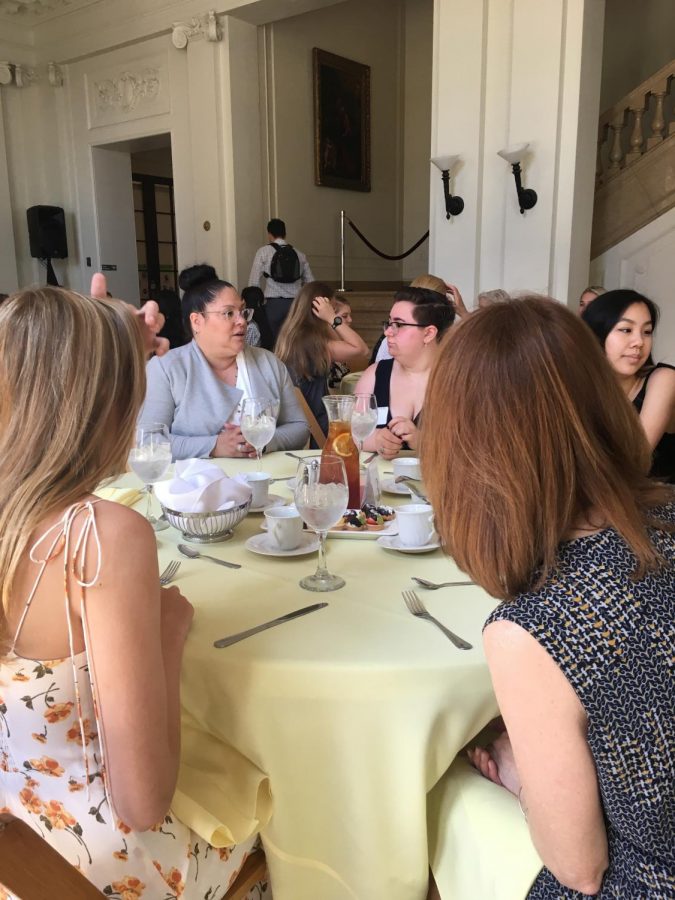 Seniors and members of the Sacred Heart alumnae network talk among themselves at the Alumnae Luncheon. During the luncheon, seniors were given sweets and gifts to welcome them into the network.
