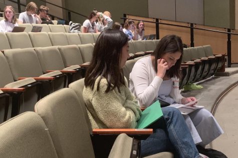 Senior Collette Hom reviews her Common Application Essay with a college admissions representative. The Common Application is accepted by more than 800 universities. 