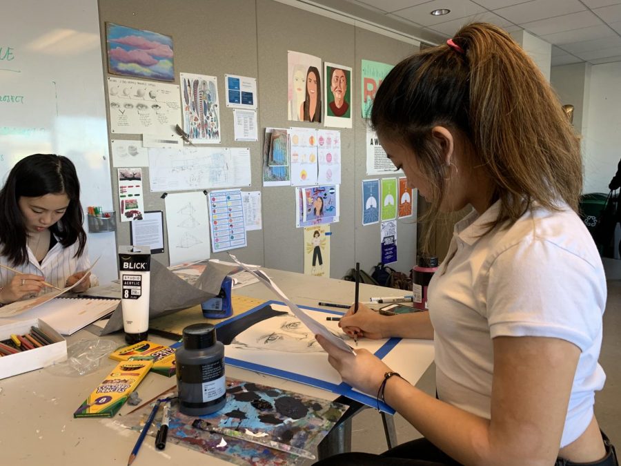 Junior Nina Sanchez uses pencil to sketch her portrait of a young boy in Pakistan. IB Visual Art students will send their finished works to the children in Nov. 