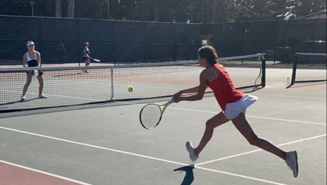 Junior Linda Karti runs to hit a backhand during a recent match against Urban High School. Karti usually plays number one doubles for Convent’s Varsity tennis team. 