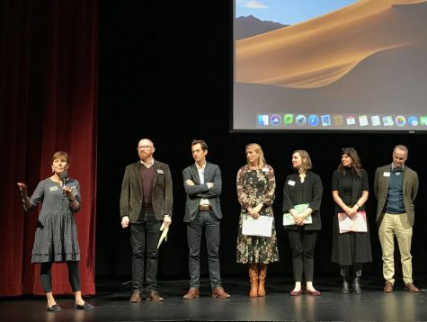 President Ann Marie Krejcarek introduces some of the chaperons of the annual sophomore Costa Rica trip on Jan. 7 in the Syufy Theatre. Sophomores met their travel groups and turned in their passports at the parent and student meeting.