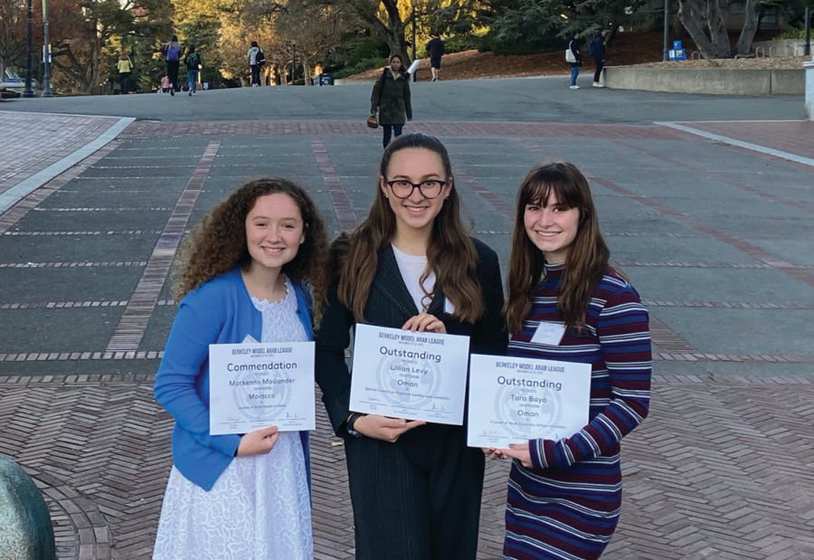 Sophomore Mackenna Moslander and juniors Lili Levy and Tara Boyd show off their awards from the Model UN conference in November. Awards are given to individual delegations for their work with personal directives and public speaking.