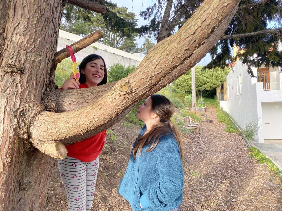 Neighbor friends find one of the crocheted emojis Simone Mar and Kiley Mar created and hid throughout the Forest Hill neighborhood. Throughout the city, neighbors are creating activities that are safe during the shelter in place. 