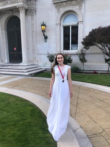 Graduate Gabriella Vulakh stands outside the Flood Mansion today before going inside to deliver her Salutatorian address. The Class of 2020 had a virtual commencement this afternoon through Zoom.
