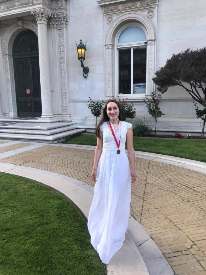 Graduate Gabriella Vulakh stands outside the Flood Mansion today before going inside to deliver her Salutatorian address. The Class of 2020 had a virtual commencement this afternoon through Zoom.