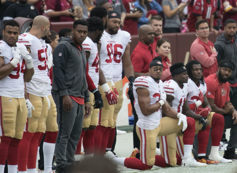 San Francisco 49ers players kneel during the national anthem to protest police brutality and racial injustice at a game in 2017. This was one form of protest in sports used three years ago that members of certain teams, such as the San Francisco Giants, employ today.