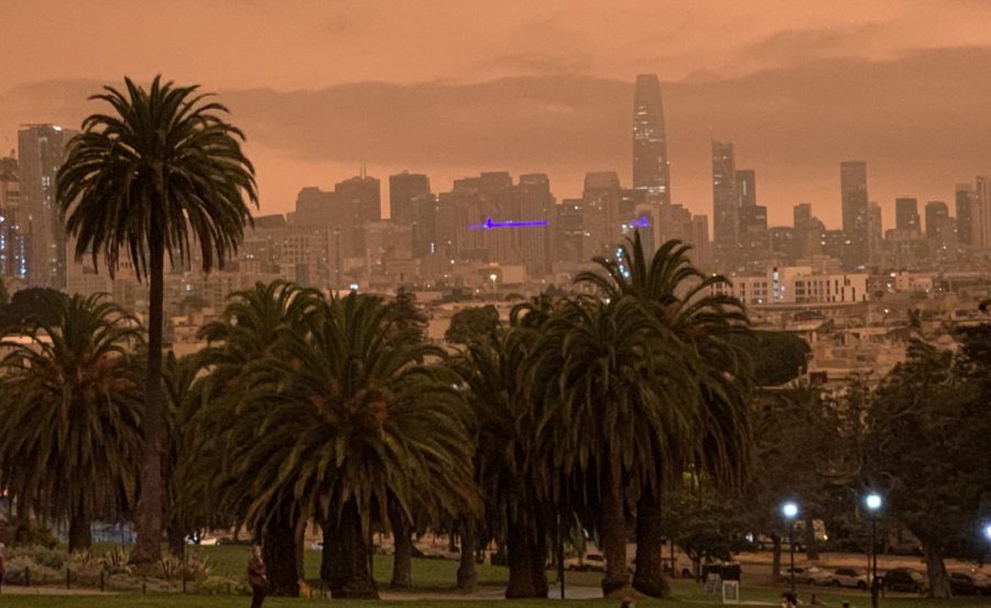 An orange haze resting over downtown San Francisco is visible from Dolores Park on the morning of Sept. 9. Despite the smoky skies, air quality was considered moderate across most of the City according to the Environmental Protection Agency.