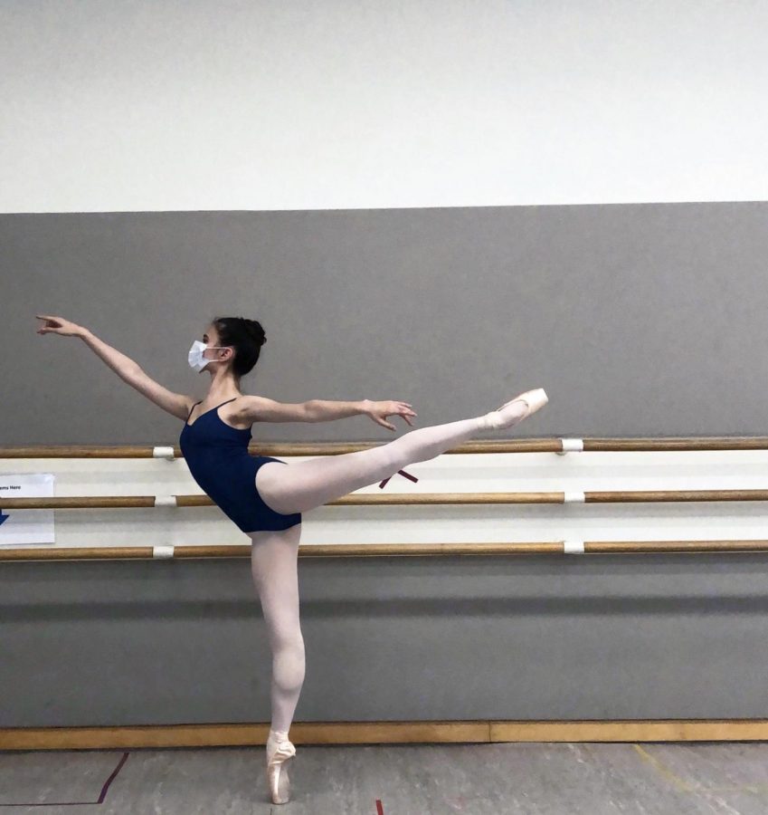 Junior Lily Peta balances in arabesque in a San Francisco Ballet School studio. SF Ballet studios were opened to company members, school levels seven, eight and trainee in October after being closed since March. 