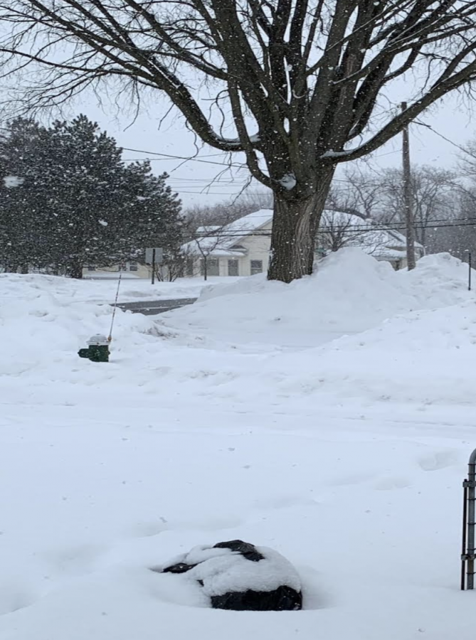 Ethics & Morality teacher Clint Hackenberg’s front porch of his family home in Ohio is covered by 6 ft snow. Extreme cold weather caused power to go out, leaving homes without heat and causing pipes to burst. 
