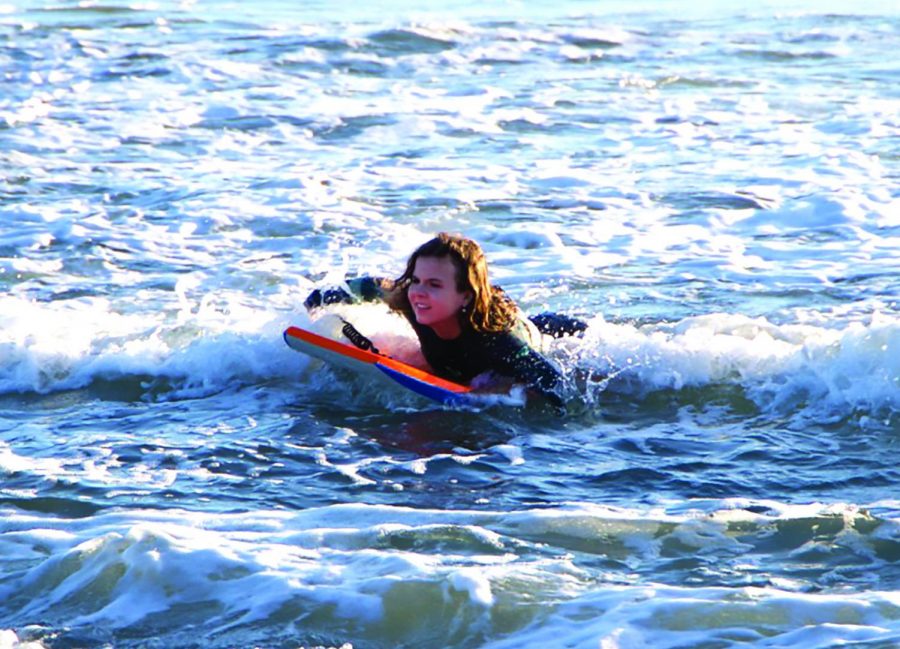 Sophomore+Amaliya+Sypult+looks+out+to+catch+a+wave+at+Rodeo+Beach+in+Marin+County.+Since+the+beginning+of+quarantine%2C+Sypult+has+surfed+twice+a+month+on+the+weekends.%0A