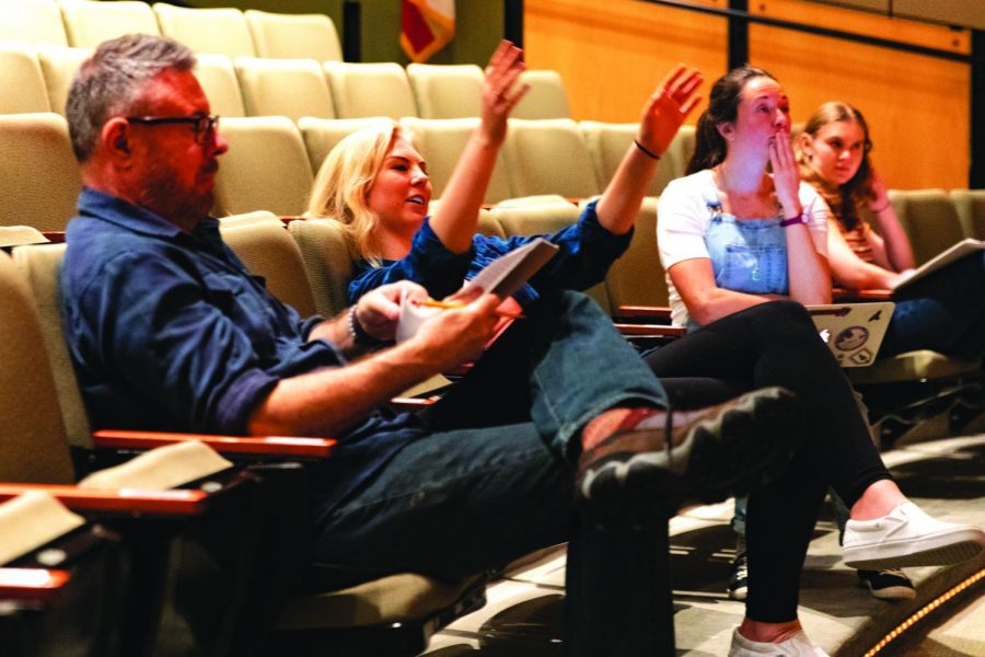 Senior Anya Hilpert sits between theater manager Chris Miller and Theater Programs Director
Margaret Grace Hee as Hilpert gives directions to actors on stage for She Kills Monsters in fall 2019.