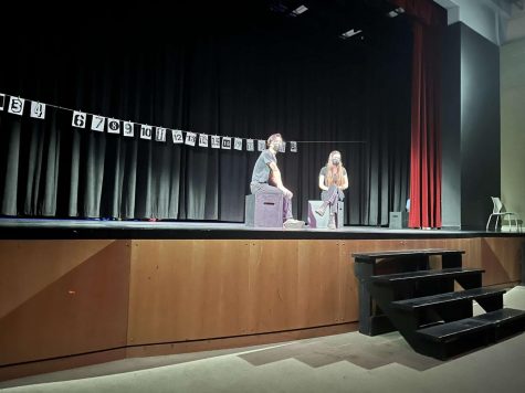 Senior Andre-Padraig Pang and junior Grace Stermer perform on stage on Friday. The production was directed by junior Azadeh Reiskin and was produced under the Students Art Workshop.