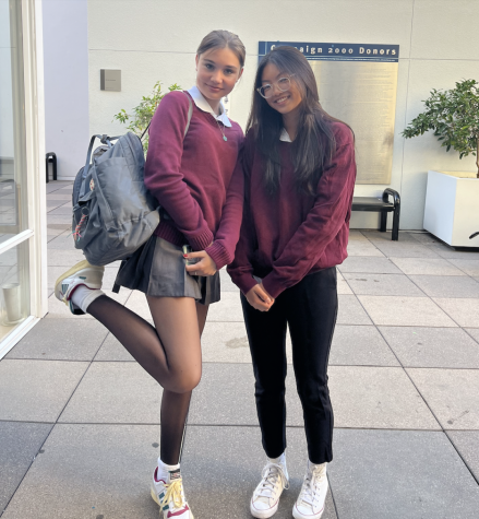 Sophomores Sarah Batt and Joelle Lai prepare to attend The Mass of the Holy Spirit in their dress uniforms. The mass occurs every year at the beginning of the school year to celebrate the start of the academic year. 