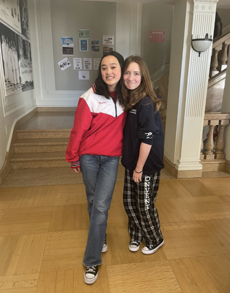 Freshmen Heidi Young and Ella Patzer wear school merchandise as a part of today’s theme to conclude spirit week. Merchandise, such as Patzers pants, is available for purchase on Convent & Stuart Halls school website.