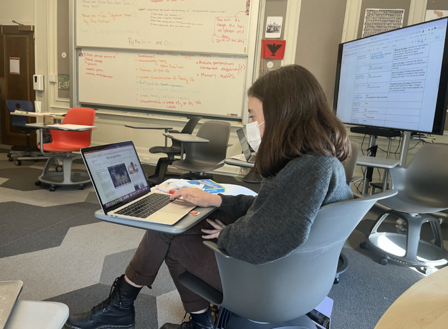 Junior Sarah Rasic scrolls through The New York Times using her school-provided subscription. Students in grades 9-12 were re-provided digital access to all The New York Times articles. 
