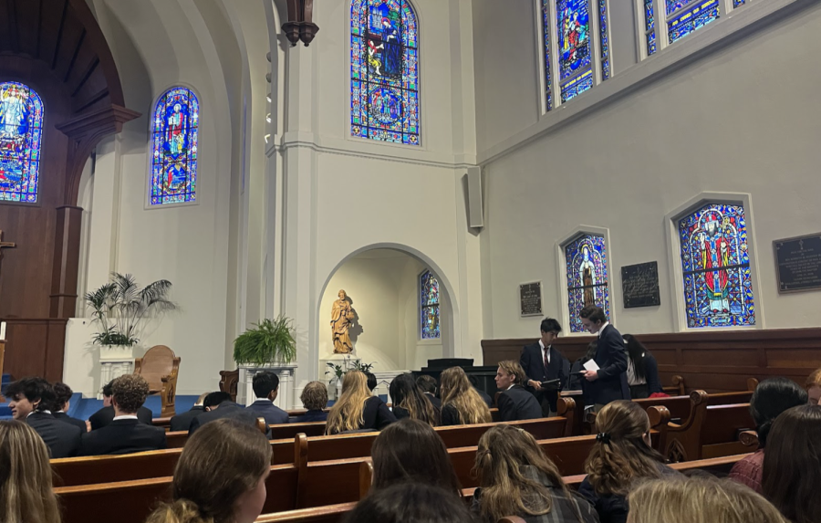 Students gather inside the St. Vincent De Paul Chapel in uniform to celebrate All Saints’ Day. All Saints Day and Dia de los Muertos are celebrated on the same day, though Dia de los Muertos is a two-day celebration. 