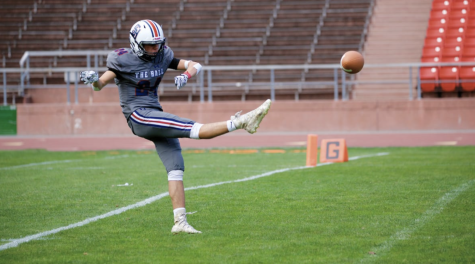 Senior Brock Bisaillon punts a ball. The mens football team plays 8 V. 8 football in the NCS League.