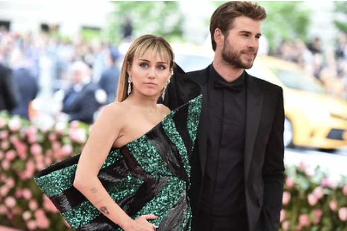 Miley Cyrus and then fiance Liam Hemsworth at the 2019 Met Gala. Cyrus and Hemsworth were in a relationship for nearly 10 years. 
