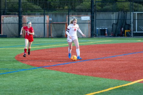 Senior Audra Dawkins dribbles the ball away from an opponent during a game against University last week. The varsity soccer team competes in Division IV of the NCS League.