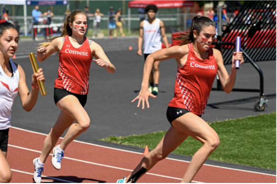 Junior Courtney Hall and Natalie Stans ‘22 running the 4x100 in the 2022 NCS Championships. The current record of 4:19.95 was set in 2022 by junior Deirdre Kenny, Hall, sophomore Sienna Faidi and junior Charlotte Lyon.
