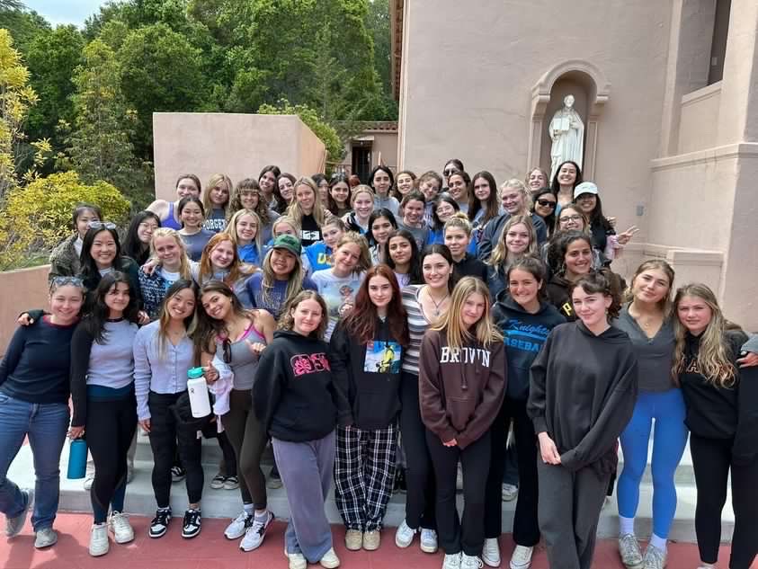 The senior class of 23 posing on their second day of retreat. The senior retreat is an annual tradition and includes bonding and reflection sessions for the classes.