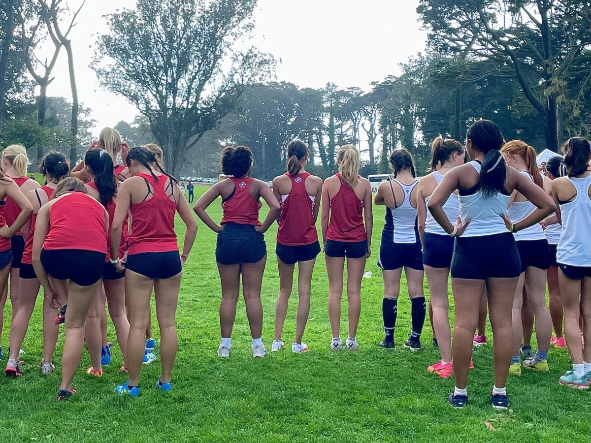 Juniors+Annika+Carpenter+and+Phoebe+Brockway+are+joined+by+Senior+Jalysa+Jones+moments+before+they+race+for+Convent+%26+Stuart+Halls%E2%80%99+Varsity+cross+country+team+in+the+Jim+Tracey+Challenge.+This+annual+event+was+first+held+on+Nov.+3+in+2017.