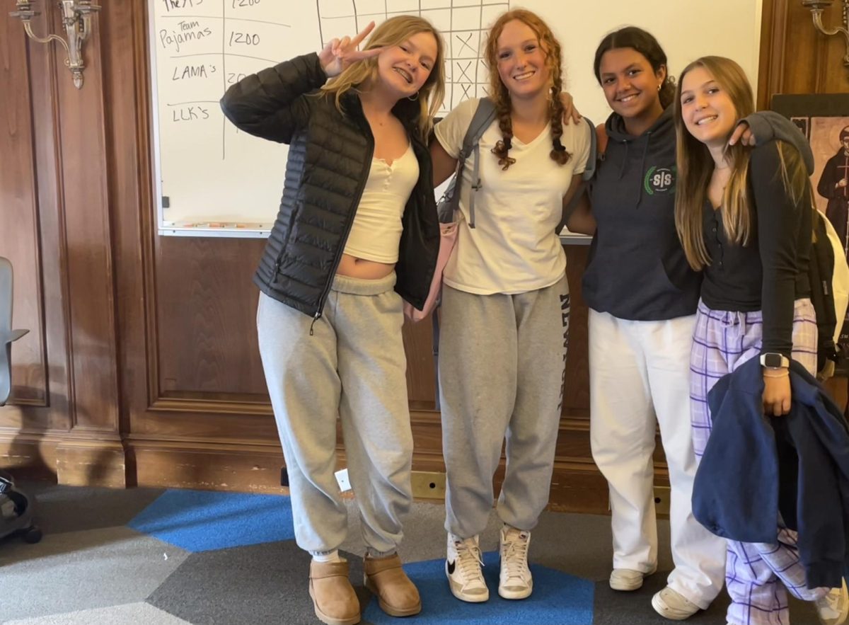 Freshmen Audrey Furtney, Annabelle Braun, Kokobe Foust, and Annabelle Carr dress up in pajamas for spirit day. 