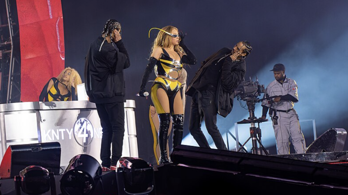 Beyoncé performs at the Tottenham Hotspur Stadium in June. She is accompanied by backup dancers and vocalists, along with a videographer. 

