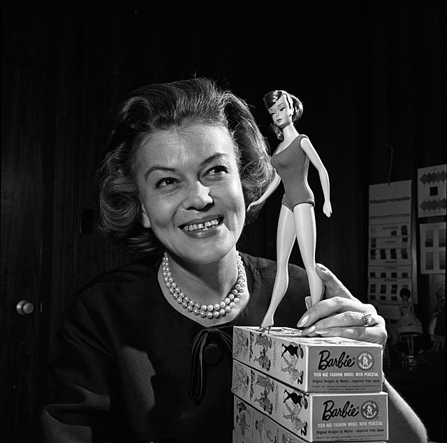 Barbies first clothing designer Charlotte Johnson posing with 1965 Barbie doll model. The first Barbie doll was released in March of 1959.