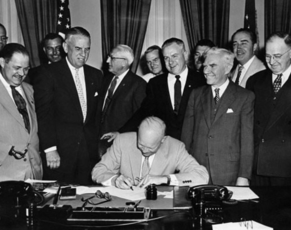 President Eisenhower signing the act to honor Veterans Day in 1954. Veterans Day was previously called Armistice Day.