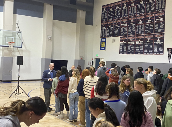 Students line up to receive ashes or a blessing from faculty members. In Christianity, these ashes are made of burned palm branches, symbolizing reflection and reconciliation. 
