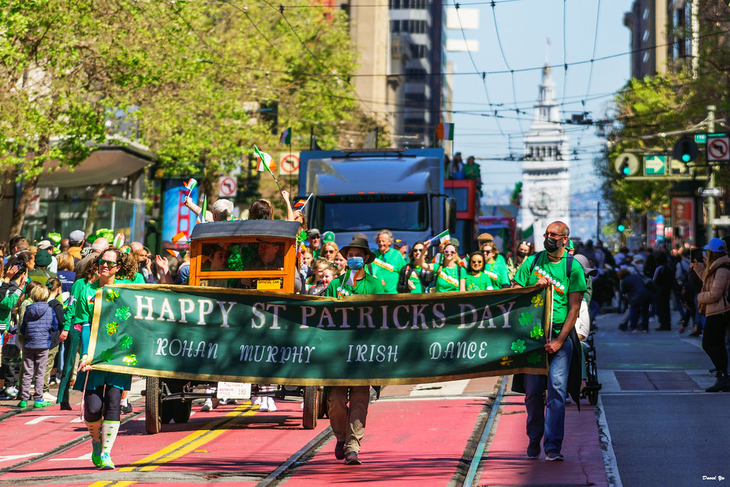 People walk the streets of San Francisco during the St. Patricks Day parade in 2022. The parade is an annual event taking place on Market Street to celebrate the St. Patrick’s Day holiday. 
