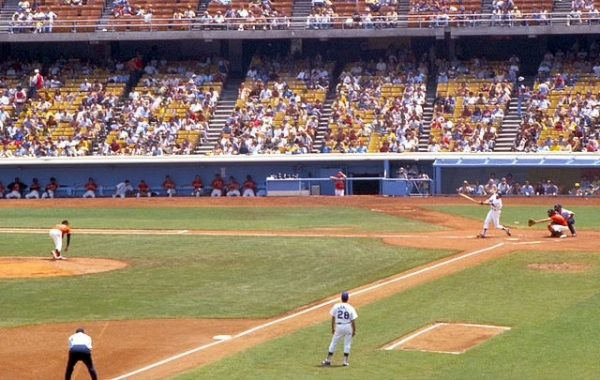 Giants vs. Dodgers game in 1977 where in the bottom of the second inning a Giants pitcher strikes out a Dodger at bat. The longstanding rivalry goes back decades, and is still alive and well today.